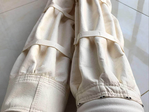 布袋除塵器滌綸布袋回灰閥門的改進及過早失效原因